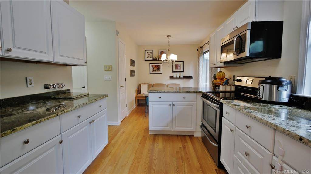 Spacious Corner Tri Level Townhome with Loft, Deck Finished Basement.