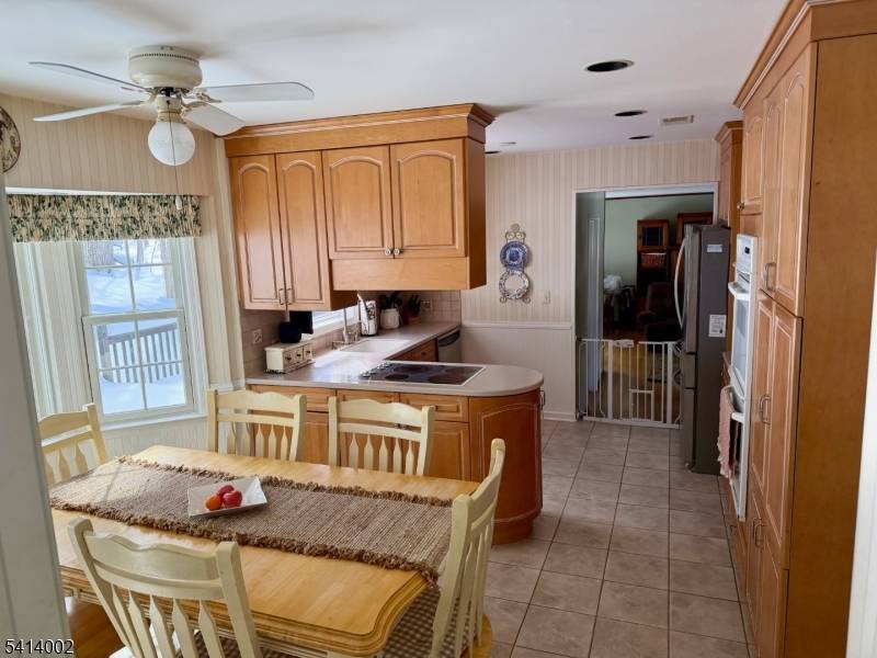 Nestled on a cul de sac in Randolph's most desirable lake community, this classic Colonial blends timeless architecture with French country warmth.