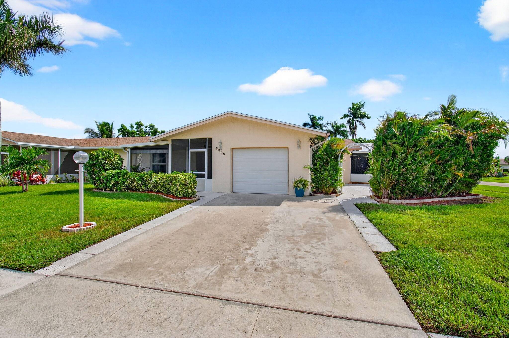 Discover the serene, welcoming ambiance of 6309 Dusenburg Road, a meticulously maintained villa located in the sought after Delray Villas 55 community in Delray Beach, Florida.
