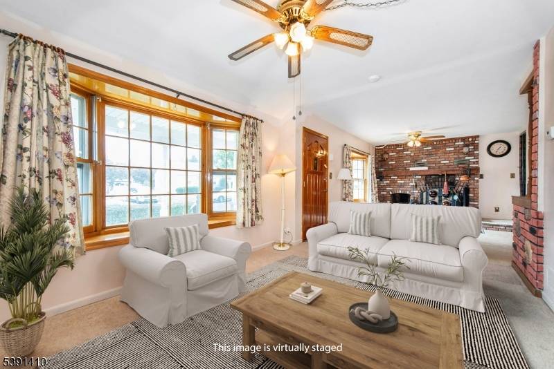 Welcome to this SPACIOUS, EXPANDED front and back dormered cape.