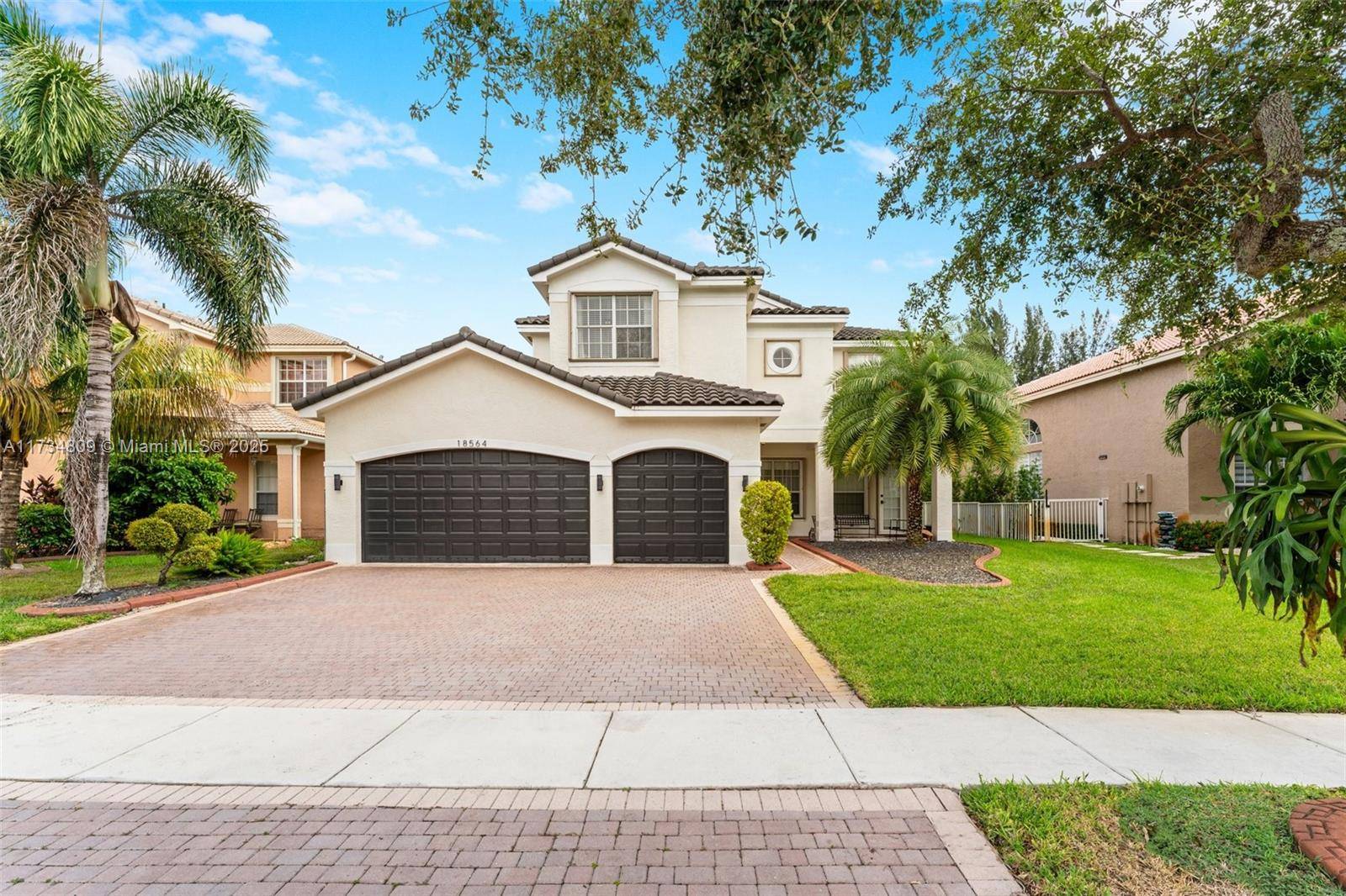 Nestled in the most exclusive gated community of Sunset Lakes in Miramar, this stunning home offers the epitome of luxury living.