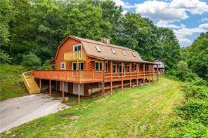 The world is yours in this log home on 28 acres of serene and secluded land !
