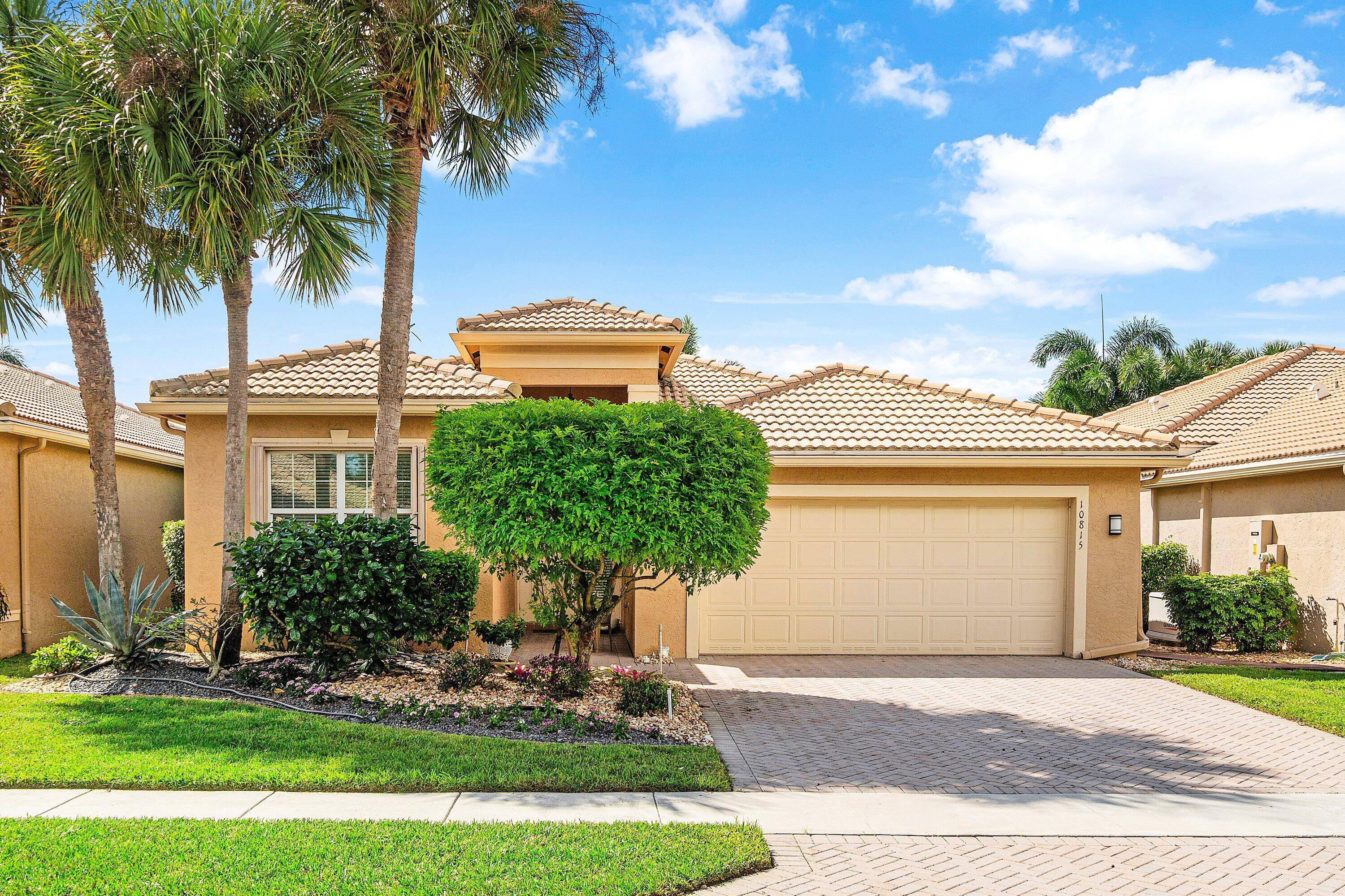 Beautifully landscaped, meticulously maintained, light and bright 2 bedroom den 2 bath home with a 2 car garage !