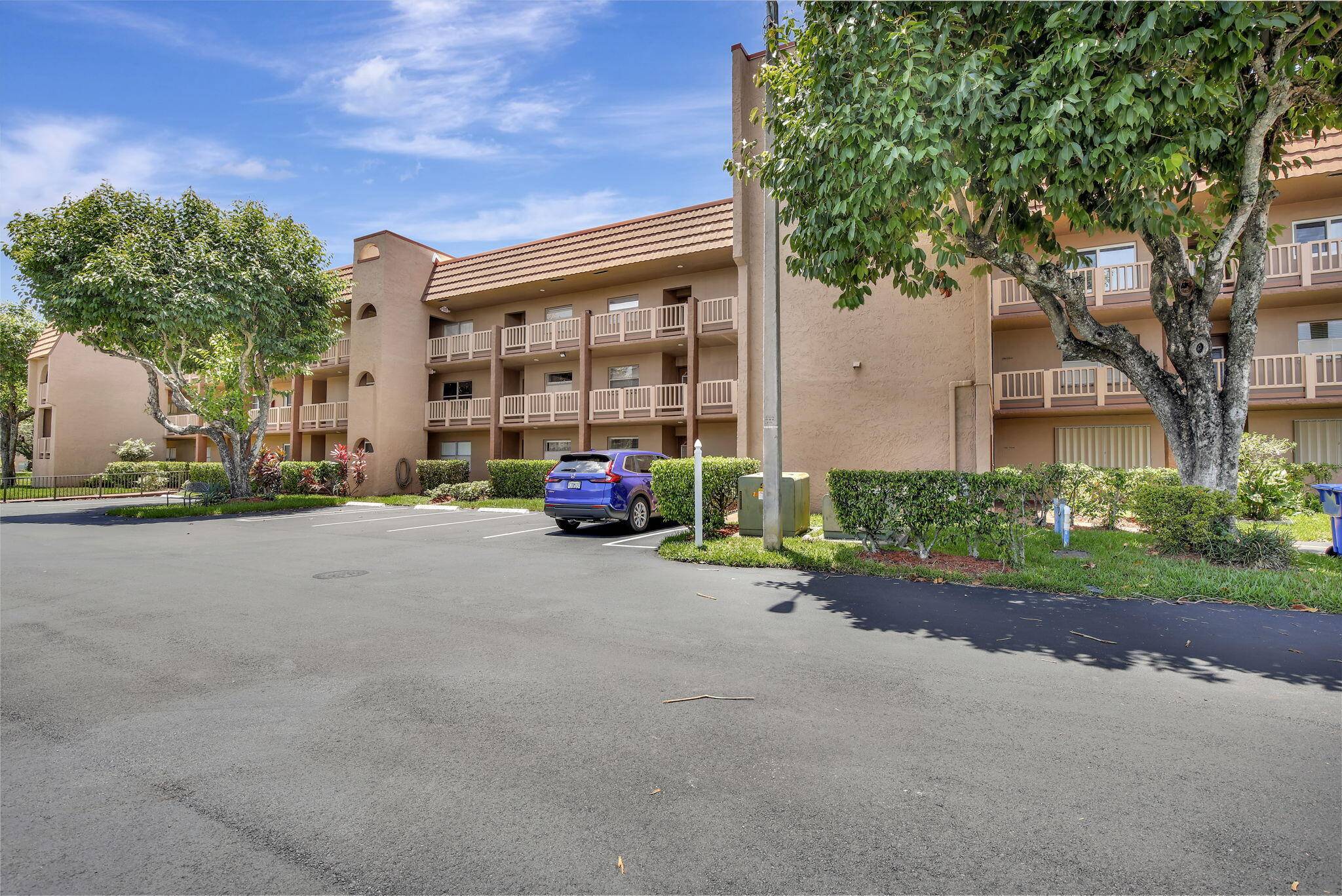 Open bright 2BD 2BA first floor condo with peaceful garden water views in a vibrant 55 resort style community !
