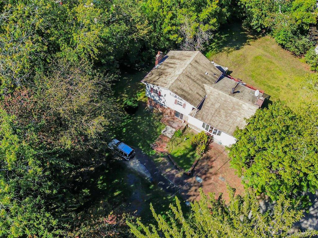 Looking for a private half acre retreat right in the heart of everything ?