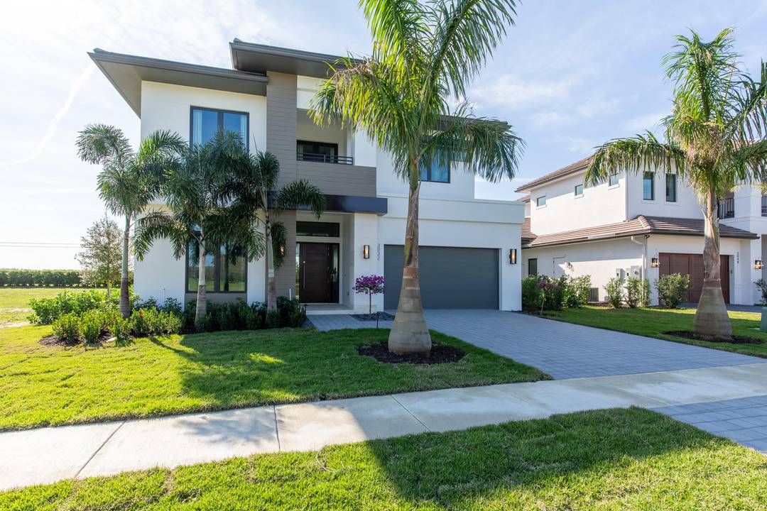 Located in the Blue Cypress neighborhood of Palm Beach Polo Golf and Country Club, this 4 bedroom, 4.