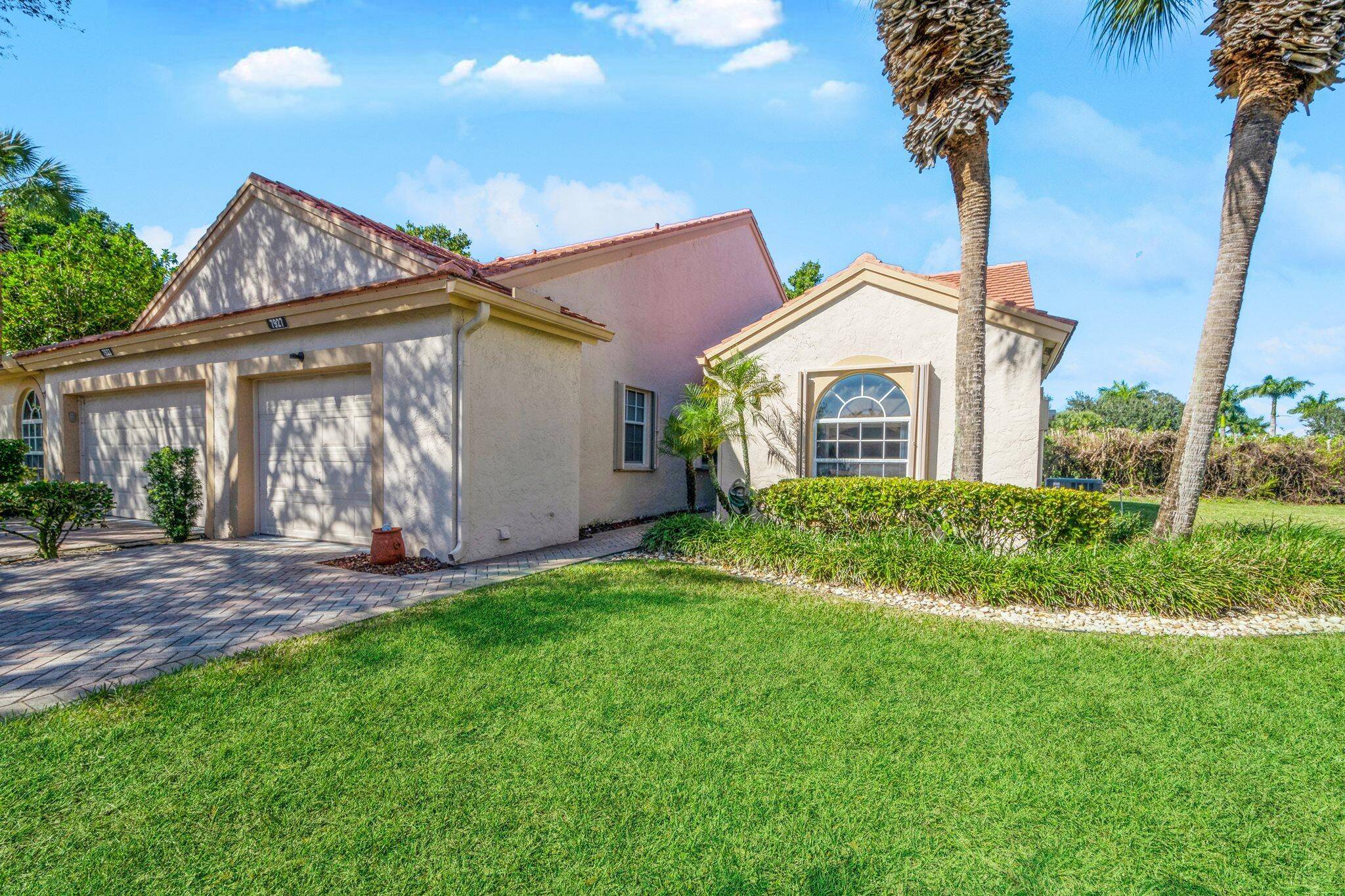 Motivated Seller. Discover your dream home in this beautifully renovated 2 bedroom, 2 bathroom corner villa with a den, nestled on a serene cul de sac with stunning Lake views.
