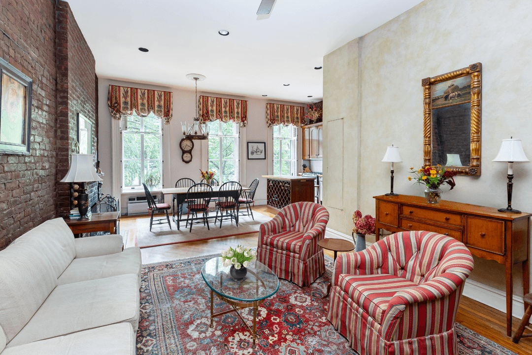 Situated on one of the most coveted blocks in the West Village, this rare two bedroom, one bathroom full floor loft seamlessly blends historic charm with modern sophistication.