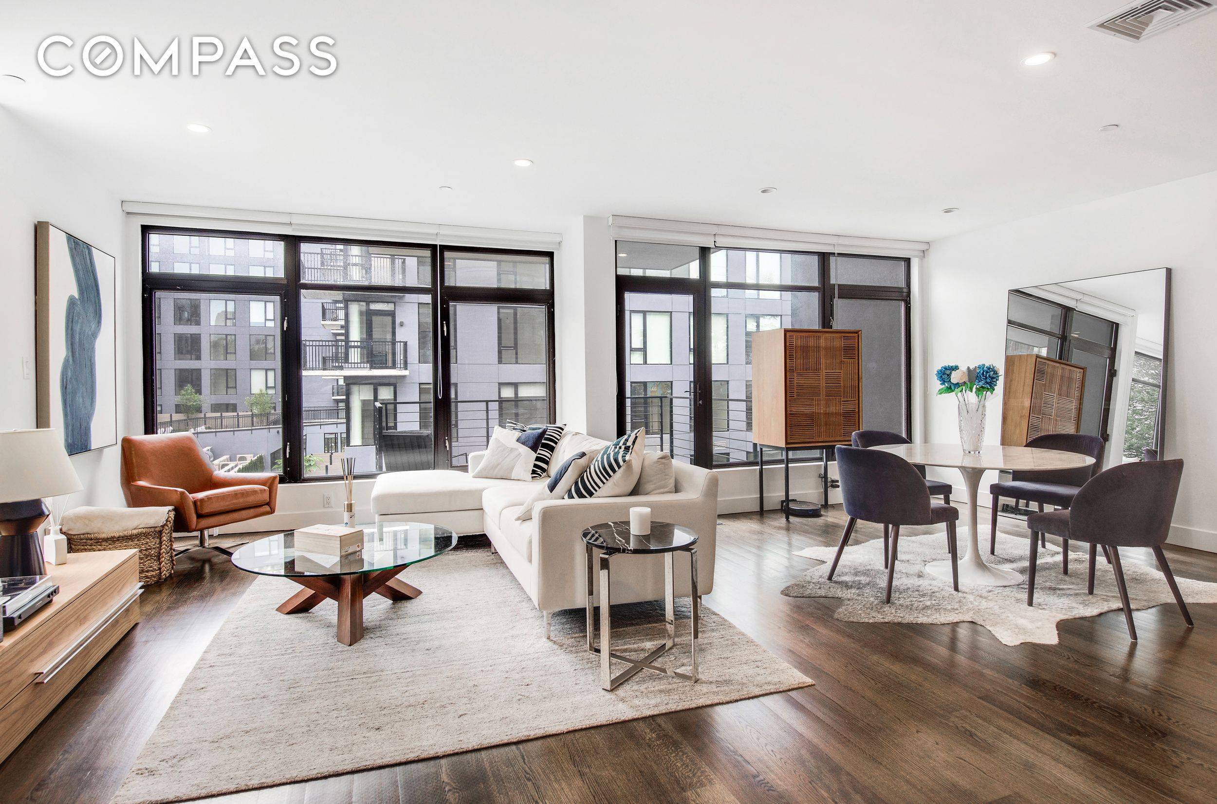 Welcome to Residence 3F at 102 Gold Street a sophisticated and sun drenched designer loft that redefines modern Brooklyn living.