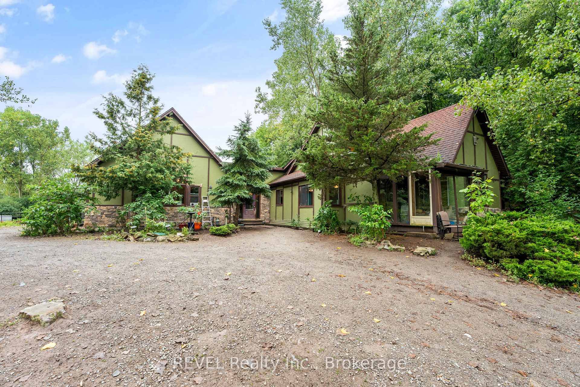 Hobby Farm set on nearly 3 acres with a 3 Bed, 2 Bath Bungalow, plus 2 cute 1 bed 1 bath cottages for guests or possible income potential.