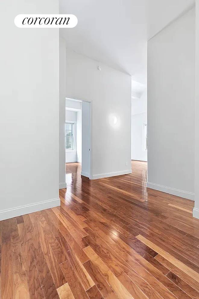 This corner one bedroom apartment with 16 ceilings throughout offers spectacular views of downtown New York and water views from oversized windows.