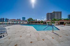 READY TO ENJOY OCEAN AND INTRACOASTAL VIEWS in this updated 2 bed 2 bath in beautiful Turnberry South.