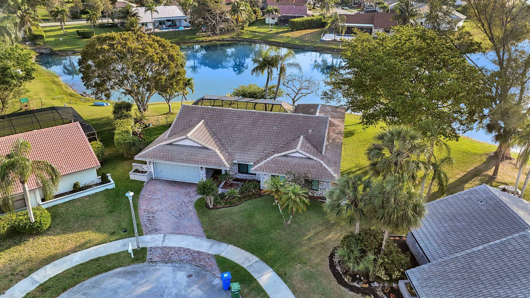 Welcome to this beautifully upgraded 4 2 pool home on a sprawling pie shaped lakefront lot !