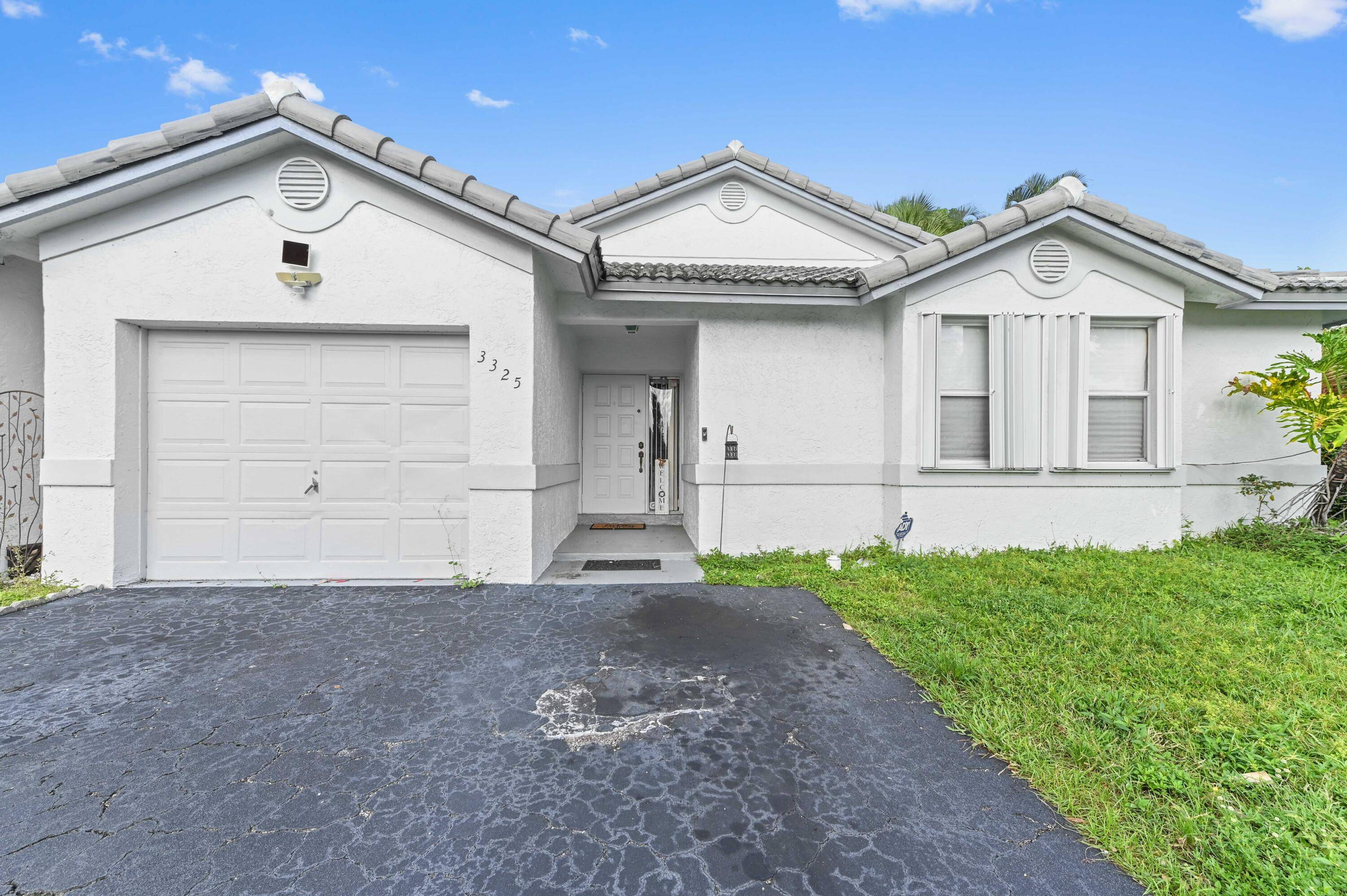 Welcome to this charming single family home, perfectly situated in the heart of Davie, offering a bright and spacious living experience.
