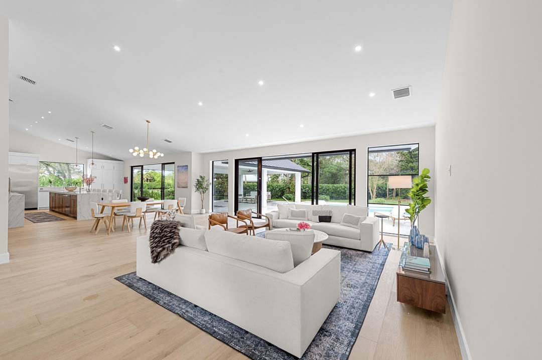 This completely renovated single family home is perfectly situated on a beautifully mature, landscaped one acre lot in the Aero Club with private air strip.