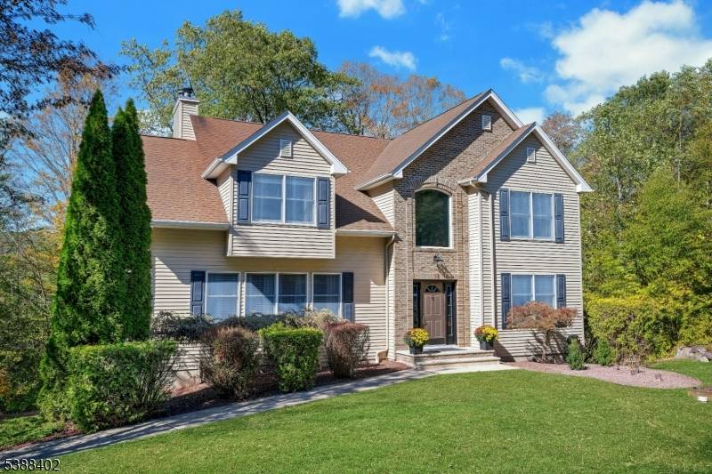 Elegant and truly turn key, this beautifully appointed home welcomes you with sunlit spaces, gleaming hardwood floors, and timeless custom moldings.