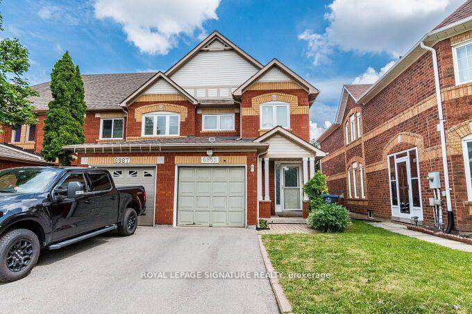 Beautifully Maintained End Unit Freehold Townhouse in Prime Lisgar Location Feels Like a Semi !