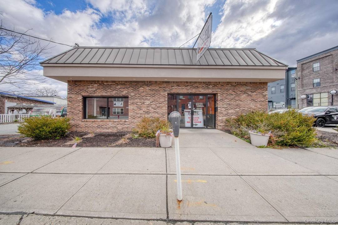 Seize a prime triple net NNN investment in a high visibility, two building retail complex situated at the main entrance of the historic Village of Goshen.
