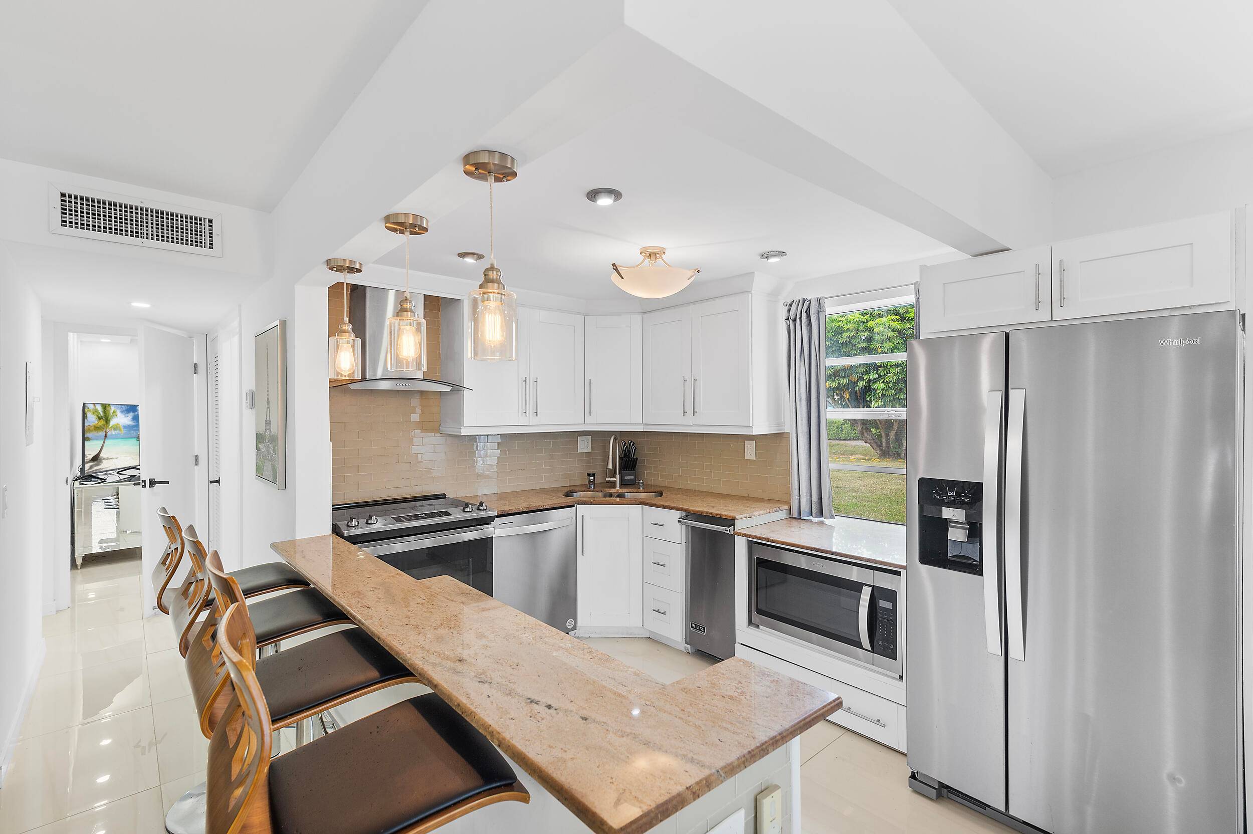 Discover luxury living in this true corner unit, a fully updated and furnished ground floor 2 bedroom, 2 bathroom condo in the 55 Kings Point Golf and Country Club.