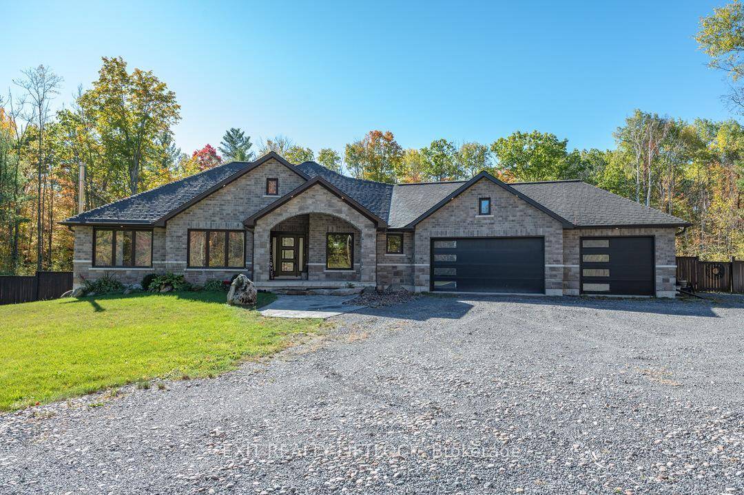 This custom built bungalow offers the perfect blend of comfort and country living on a 2.