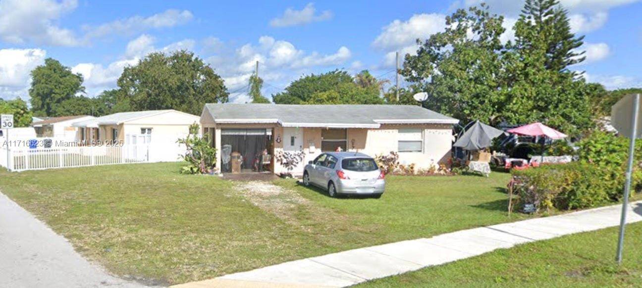 Centrally located, 7100SqFt corner lot with a one car garage.