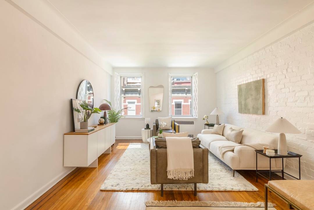 Spacious and bright corner convertible 2 bedroom apartment on the top floor of a well run and charming full service cooperative located on a tree lined street at the intersection ...