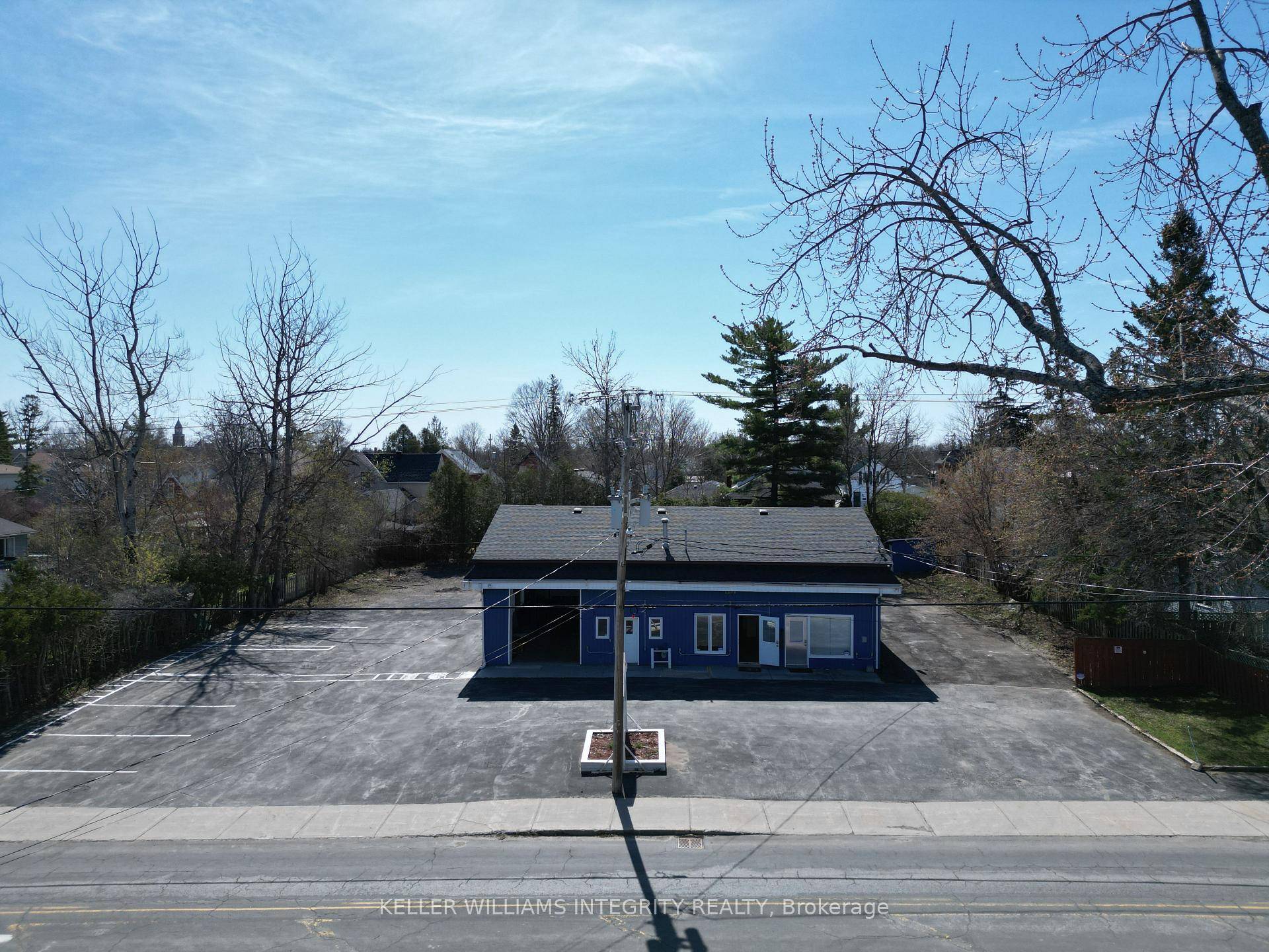 Auto garage industrial warehouse building with interior office space on a large 0.