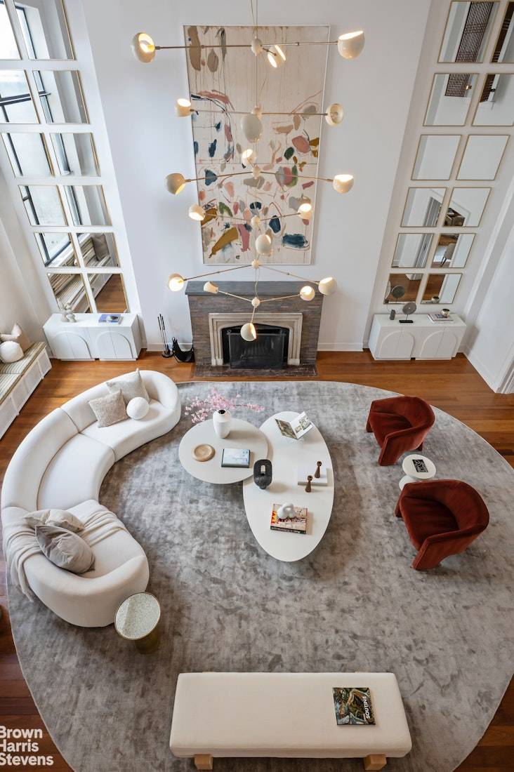 A dramatic and spectacular penthouse apartment with 20 foot ceilings and a large square terrace.