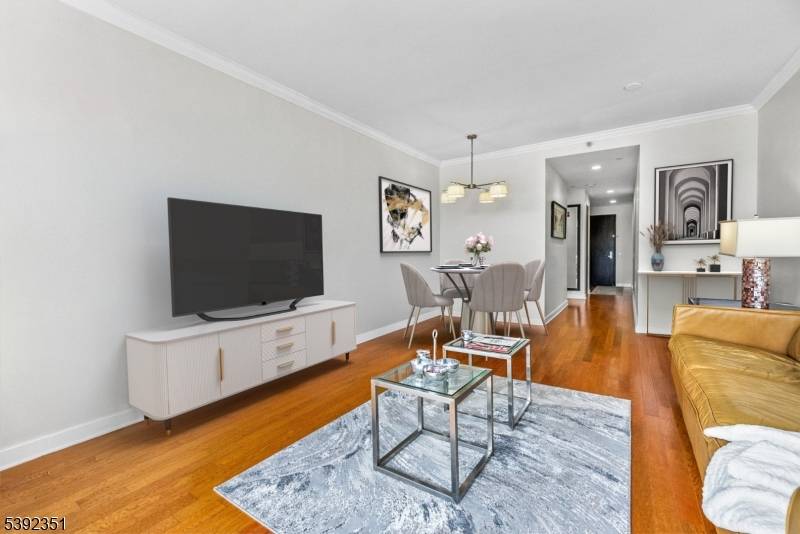 Sleek Style and Skyline Views in Edgewater Luxury LivingPrivately positioned and beautifully maintained, this corner penthouse style condo offers breathtaking views of the New York City skyline and the Hudson ...
