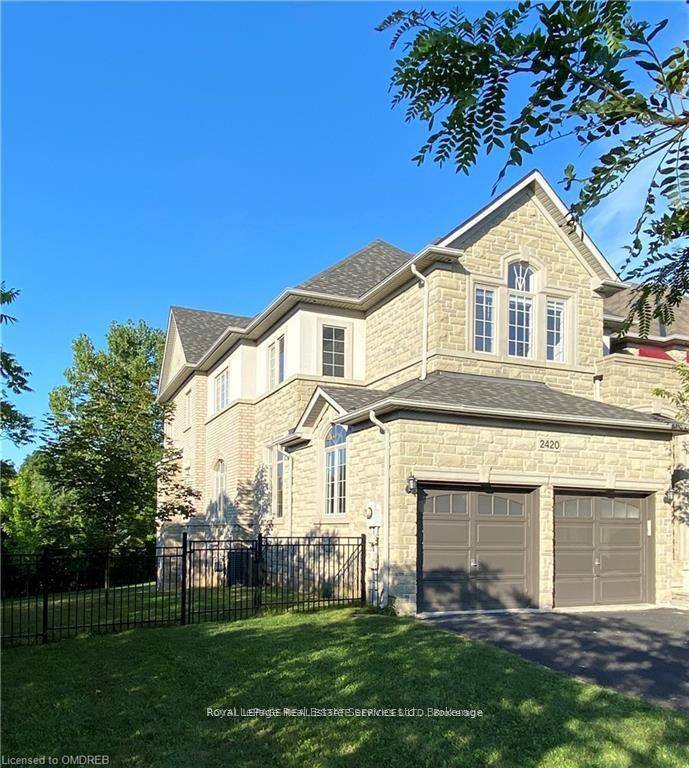 Welcome to 2420 Valleyridge Drive, a fabulous custom end unit Executive home tucked away in desirable Bronte Creek.