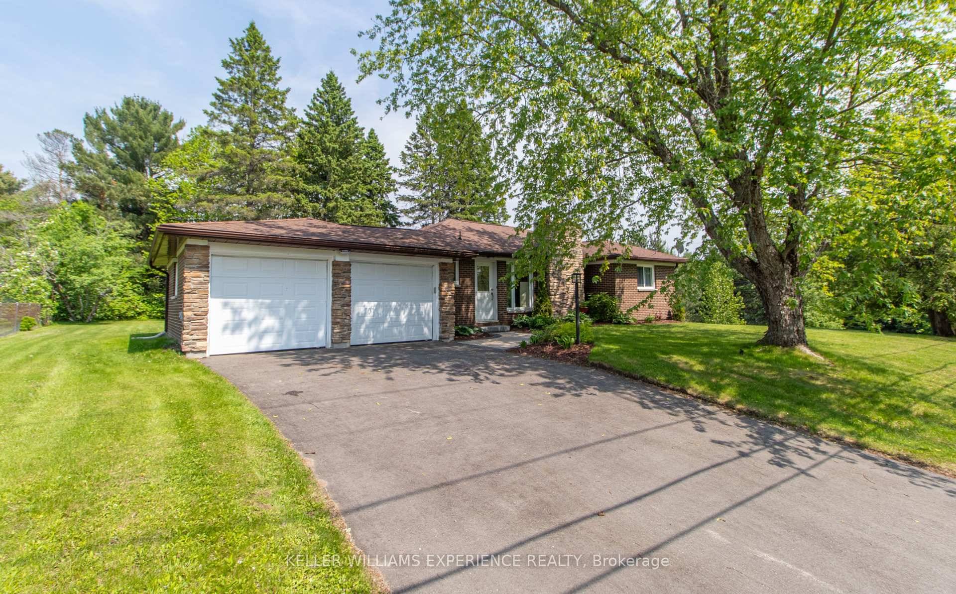 Timeless curb appeal meets small town convenience in this lovingly maintained, all brick bungalow on a sprawling, park like corner lot in Sundridge.