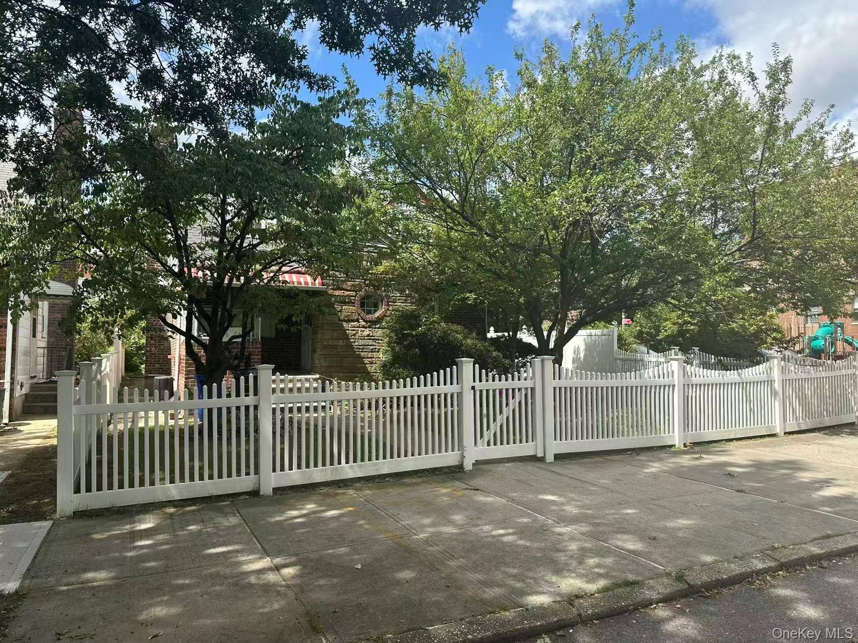 Charming Cape Cod style single family home located on a fenced corner lot in the heart of Flushing.