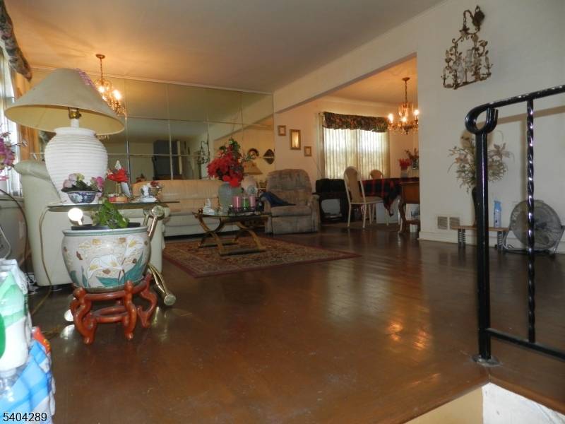 Ground Level split with 3 bedrooms, living room, dining room, eat in kitchen, family room, 2 full bath, unfinished basement 1 built in garage.