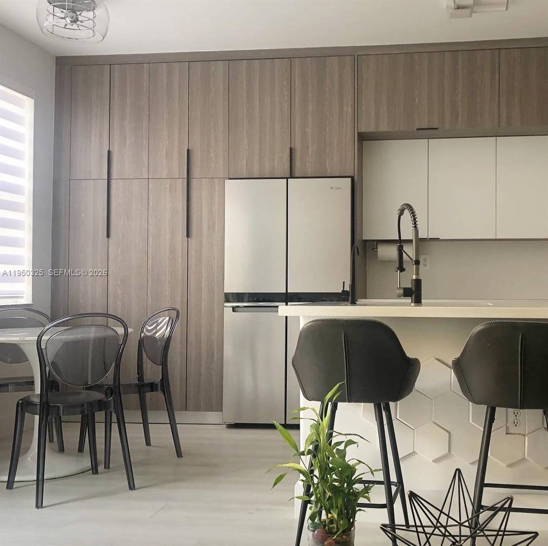 Beautiful Townhome with garage, completely remodeled with updated modern kitchen and bathrooms, luxury vinyl floors amp ; stairs level patrio with modern large format pavers, perfect move in ready home.