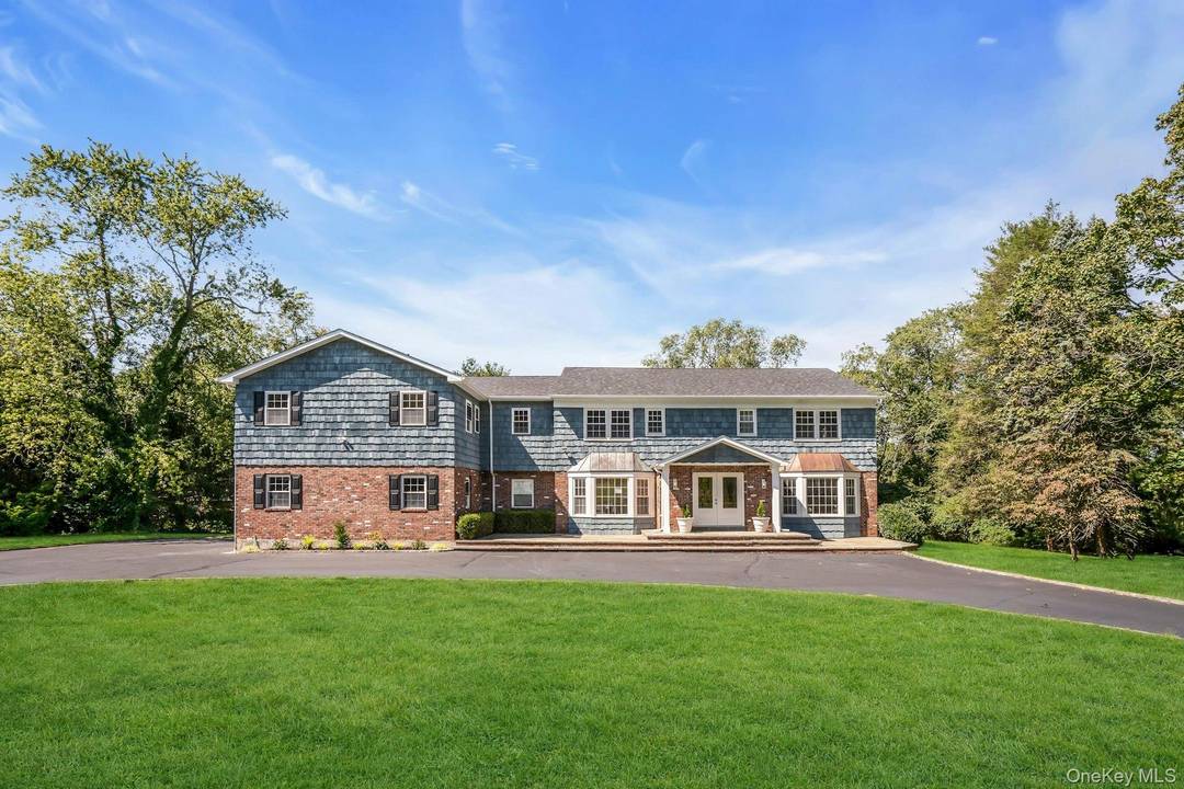 Welcome to 20 Rolling Drive, Glen Head, NY Set on a pristine 2 acres of rolling lawn.