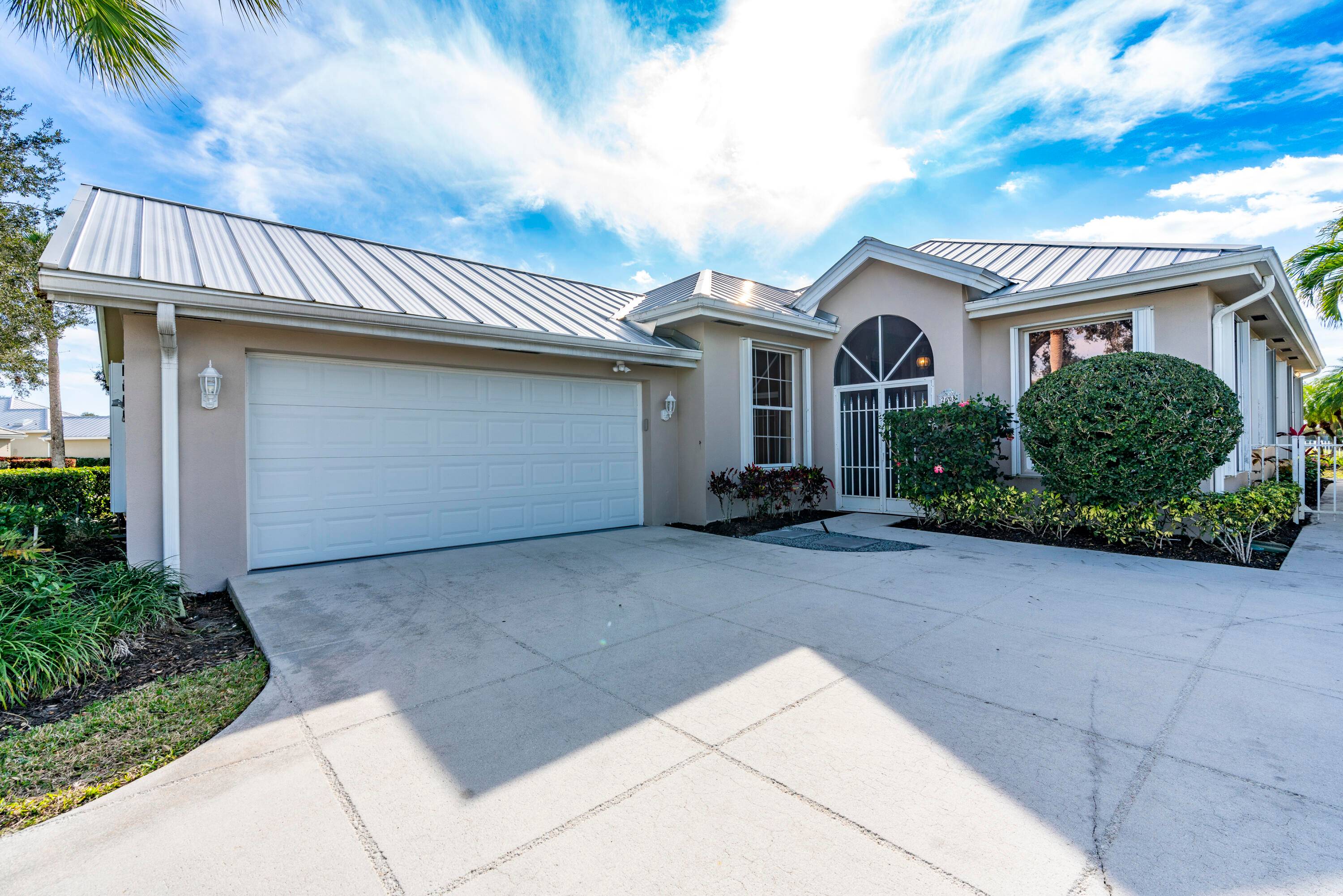 Welcome to this charming 3 bedroom, 2 bathroom located in the sought after gated community of The Meadows in Palm City.