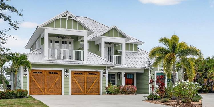 Paradise awaits in this stunning 5 bedroom, 5 bath, Key West style home that offers the perfect blend of luxury and coastal living !
