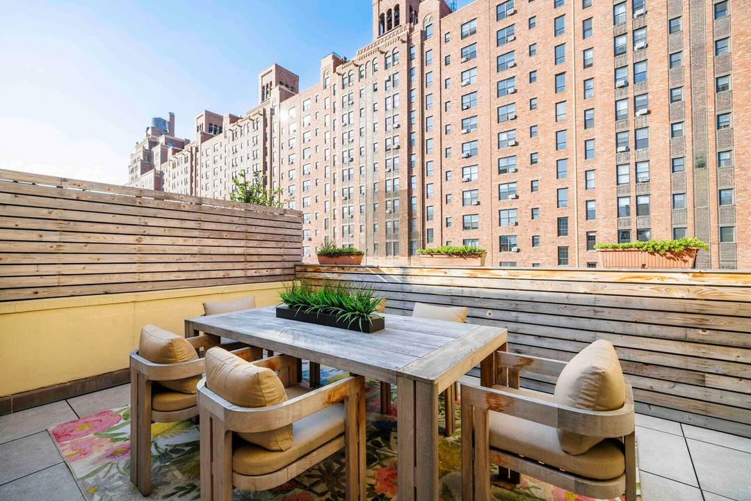 This exceptional Chelsea townhouse penthouse duplex opens to remarkable light, volume, and sweeping views over West Chelsea's historic rooftops.
