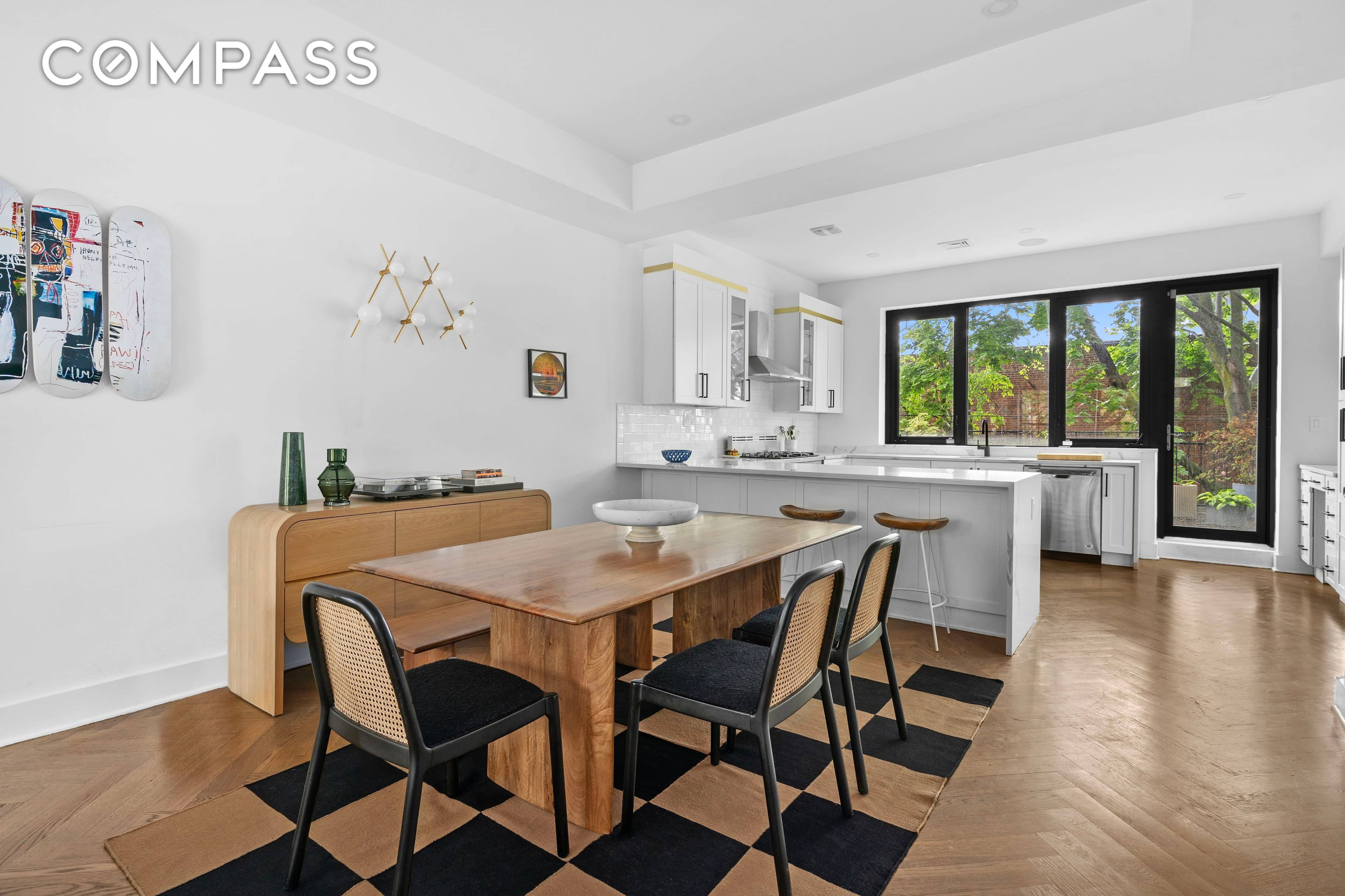 Originally built in 1910, this beautifully renovated two family townhouse blends timeless charm with modern luxury.