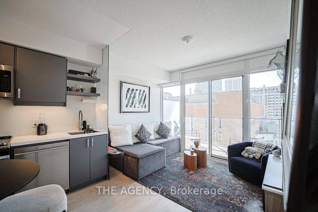 Stunning south facing 1 bedroom den suite with floor to ceiling windows, custom designer upgrades, and wide plank flooring throughout.