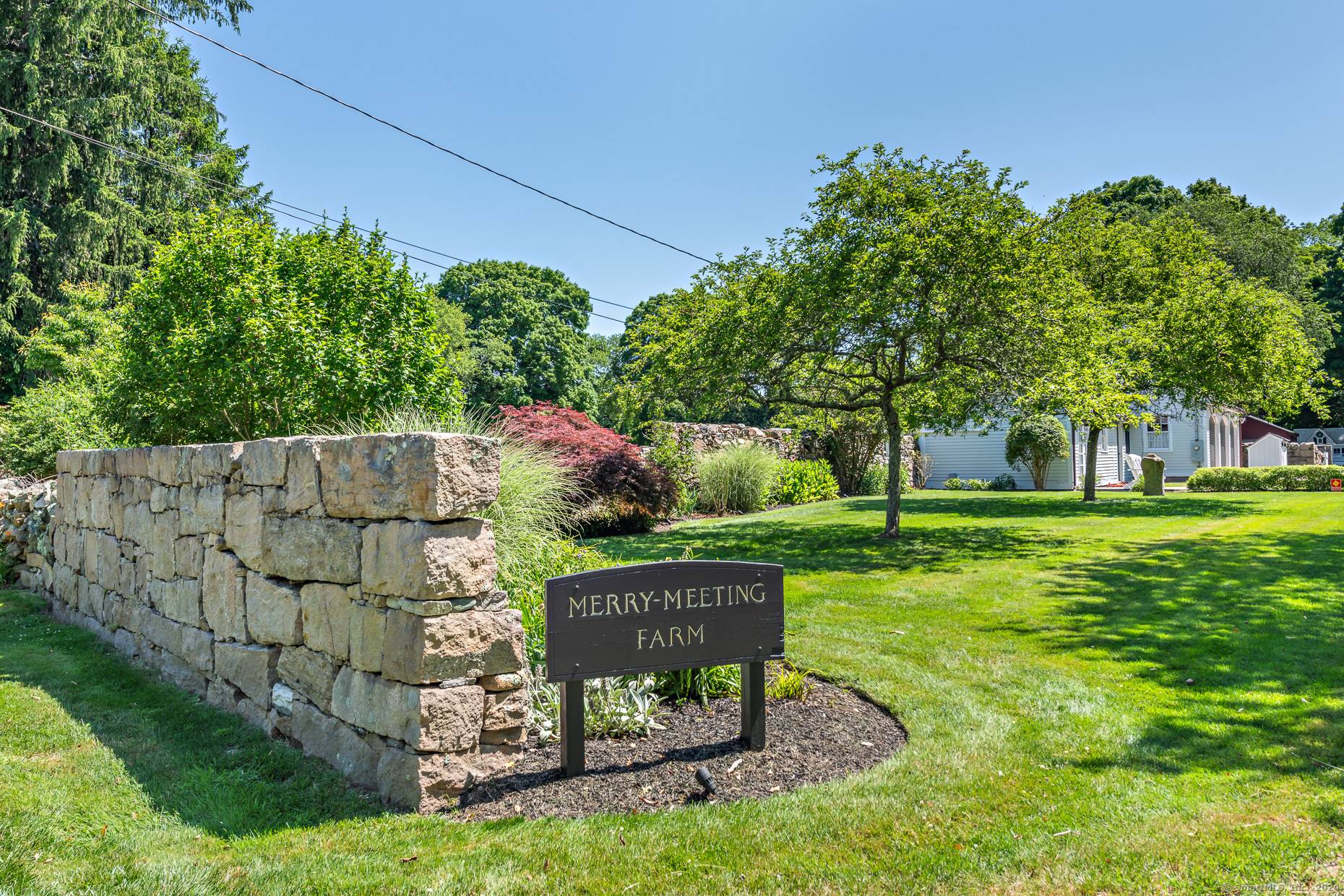 Peace and serenity surround this antique Georgian center chimney colonial, a stunning example of architectural history.