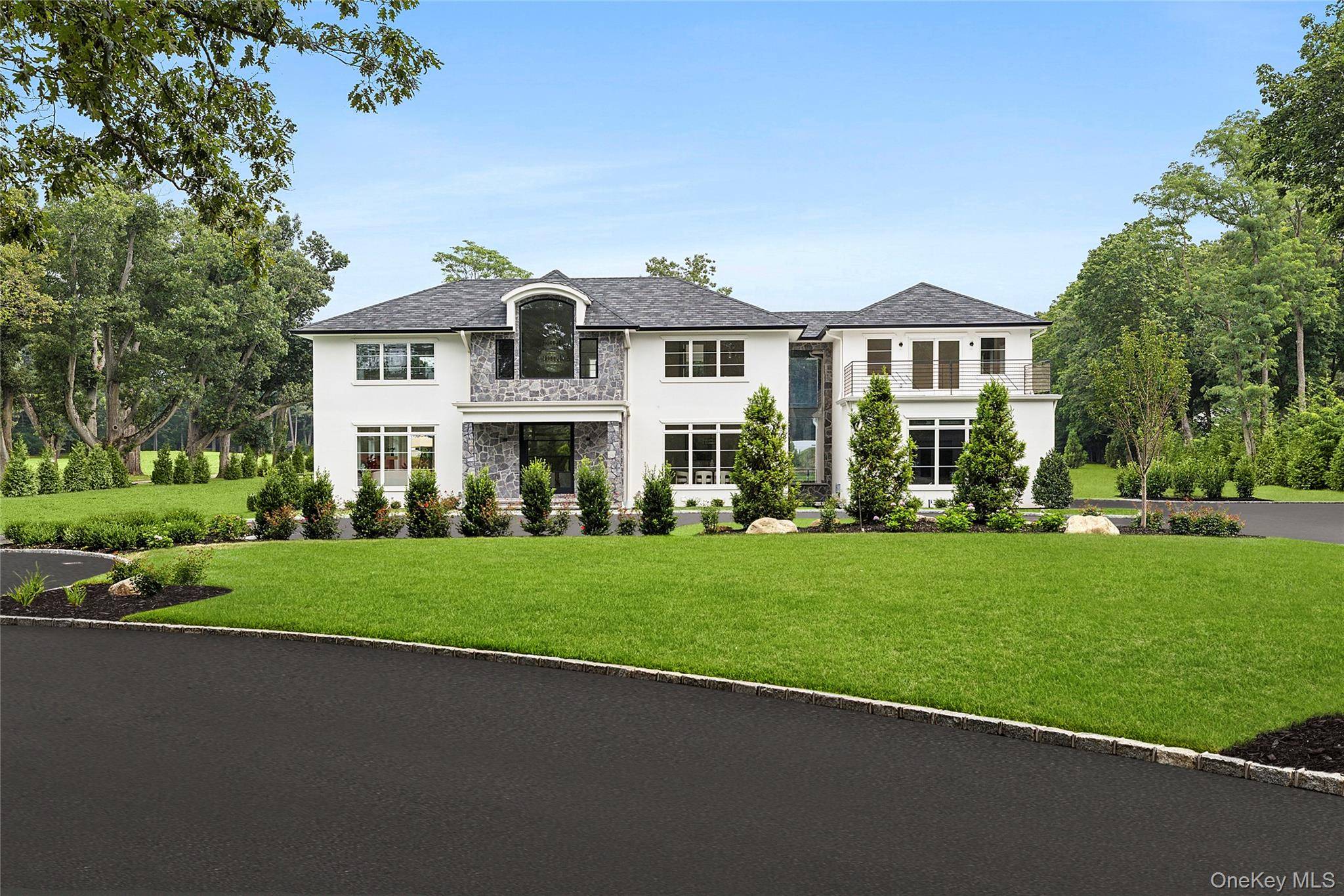 Welcome to 70 Wheatley Road, a newly built 6 bedroom, 6 full and 2 half bath home on a quiet cul de sac in Old Westbury.