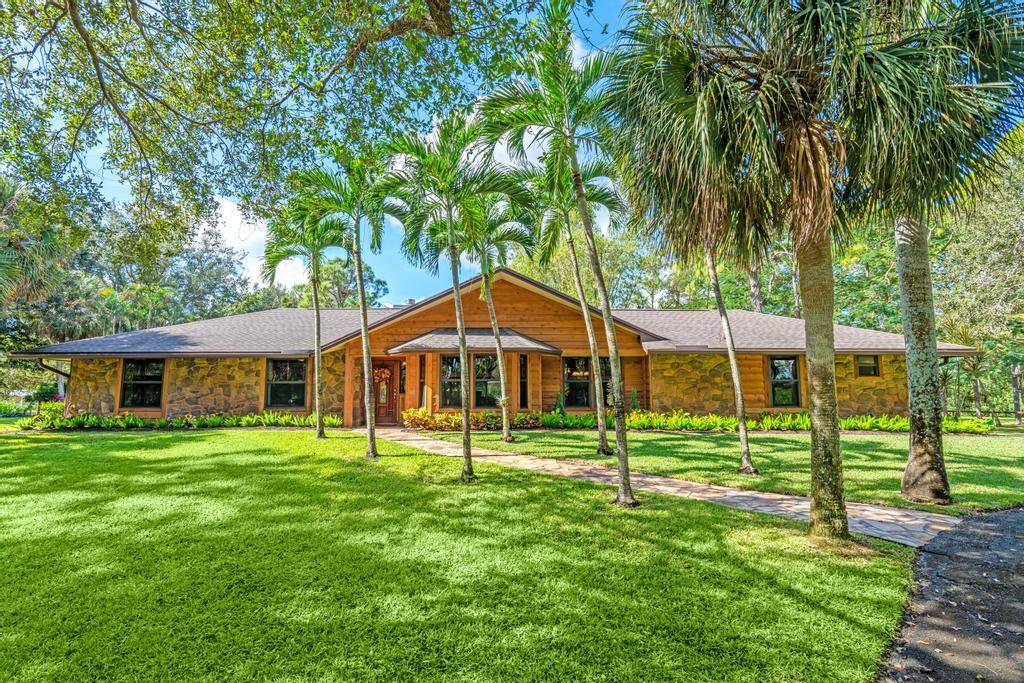 Welcome to your dream equestrian estate, set in a picturesque 10 ACRE PROPERTY in a coveted equestrian community of Homeland.