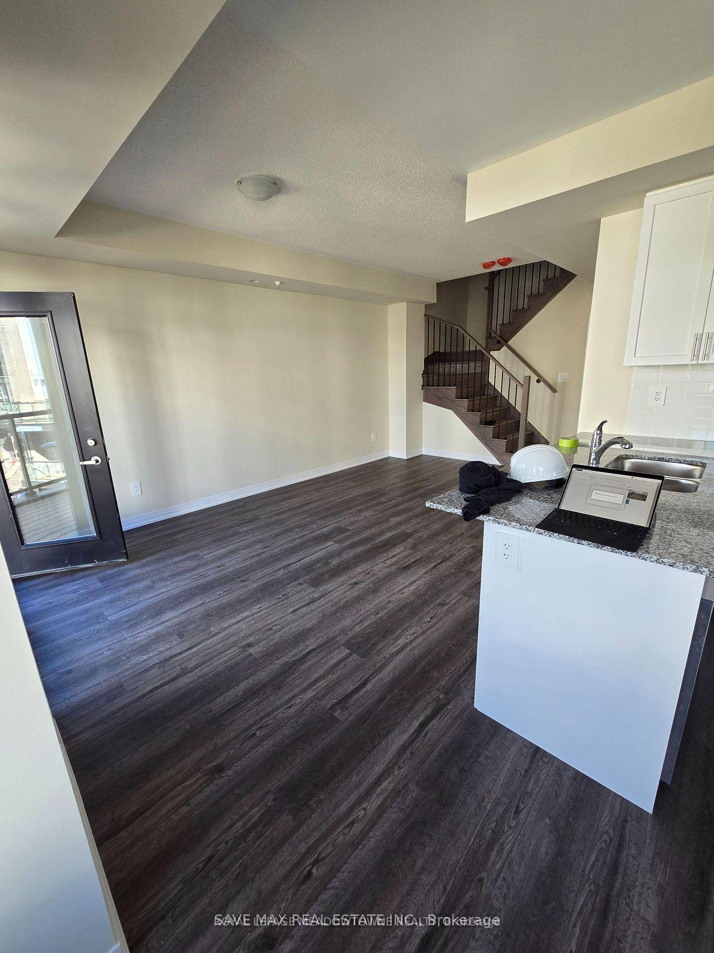 This Modern 1300sqft, 3 bedroom 2 bathroom newly constructed Condo Stacked Townhouse features large principal rooms with a walkout to a front terrace and balcony.