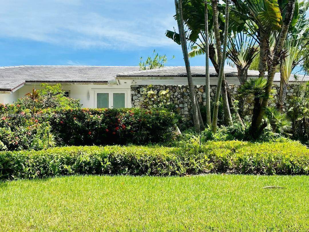 This beautiful house sits on an elevated lot in prestigious Gables by the sea.