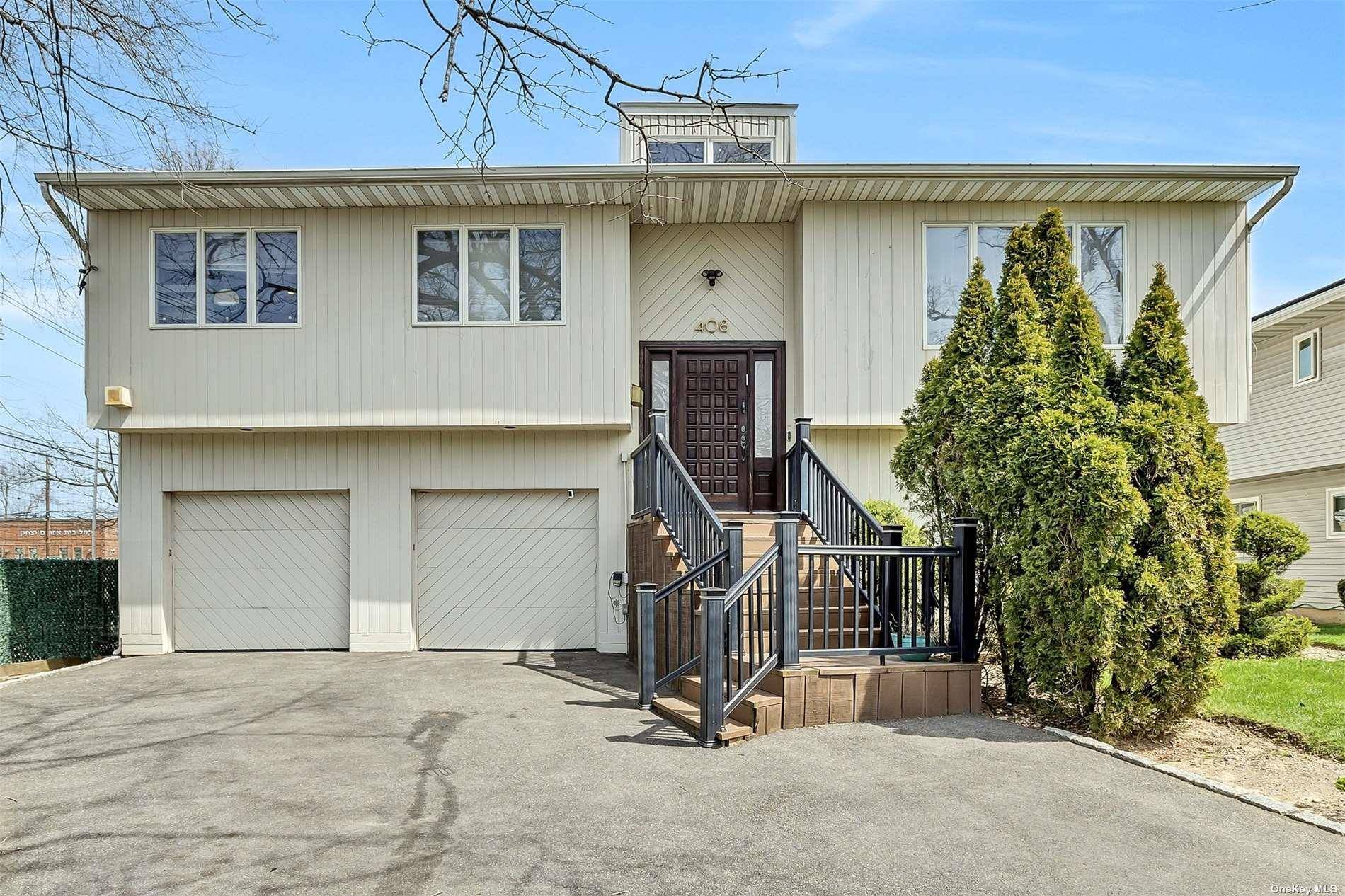 Welcome to this exceptionally renovated home with low taxes in the heart of Woodmere !