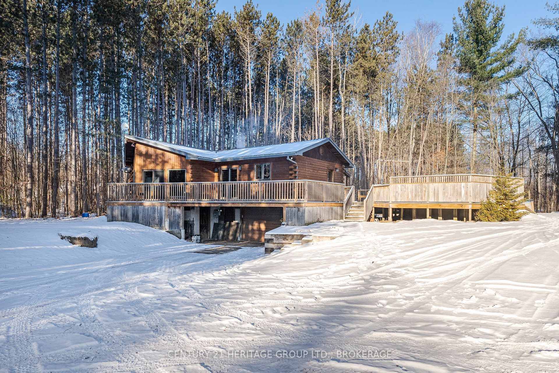 Absolutely stunning log home nestled on a spacious lot, a perfect woodland setting for your next chapter !