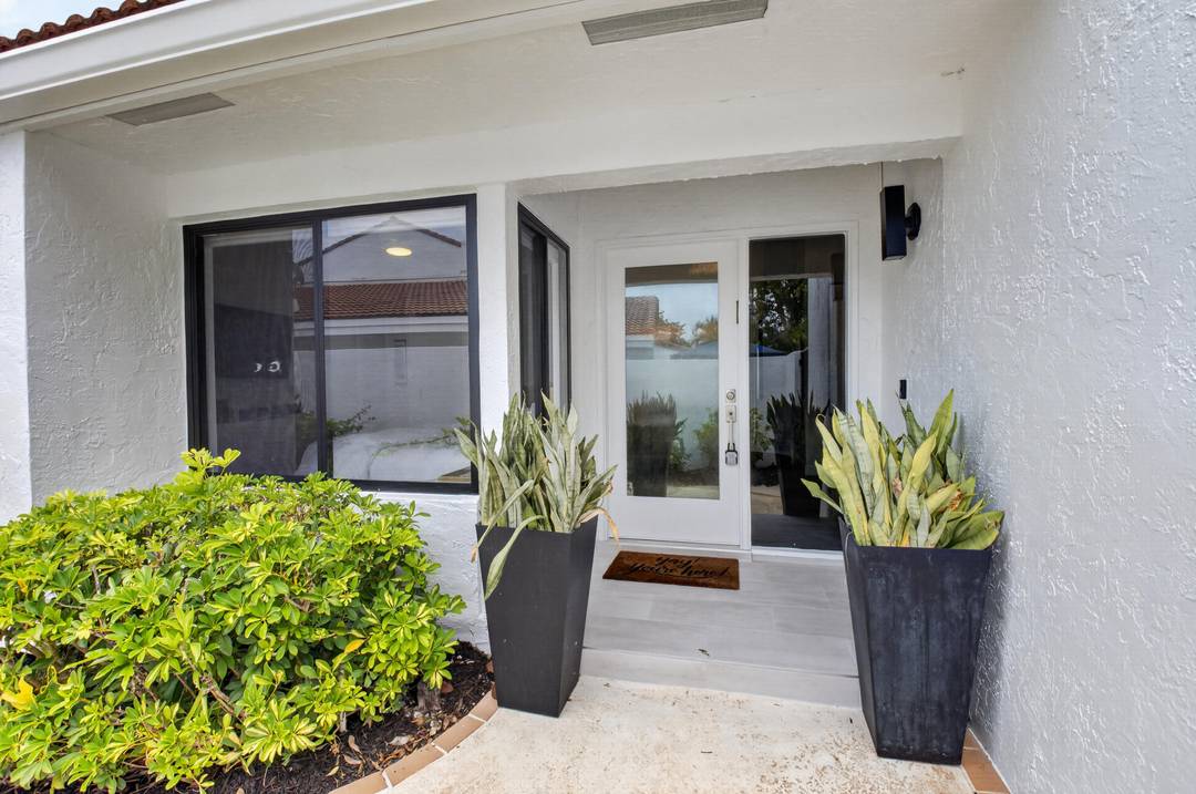 Experience the quintessential Boca West lifestyle in this impeccably renovated one level Woodcrest villa.