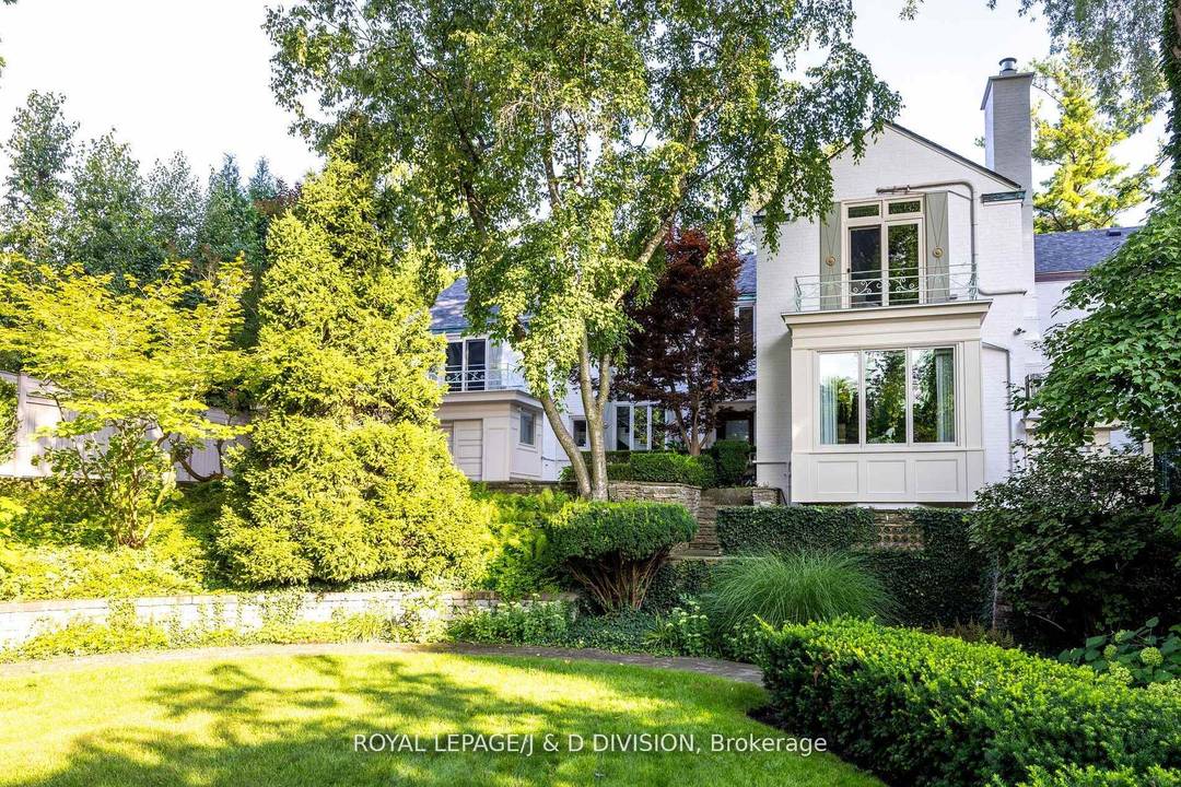 Tucked away on one of Toronto's most prestigious streets and private enclaves, this exceptional residence offers unparalleled seclusion, gracefully set back from the street on an expansive L shaped lot ...