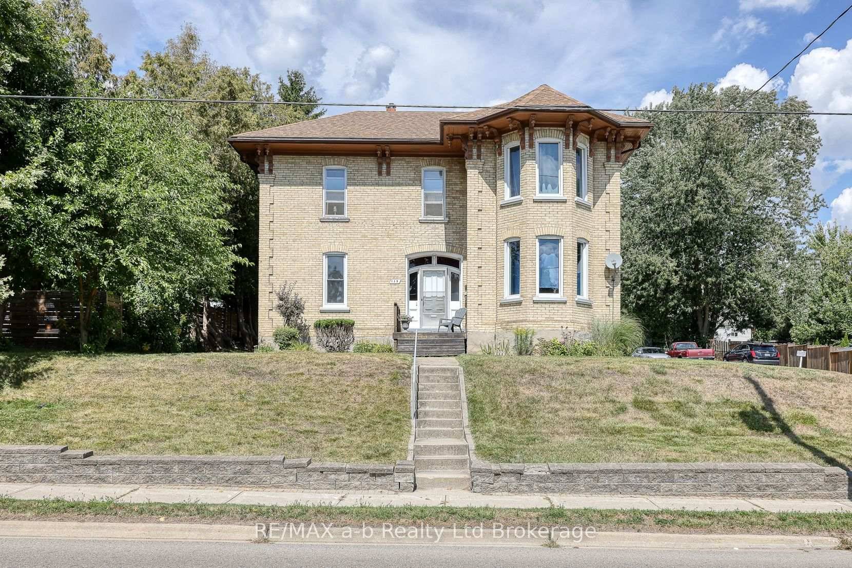 Welcome to 135 Canterbury Street, Ingersoll, a stately yellow brick triplex with timeless character and modern updates.